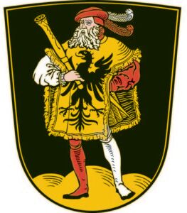 Wappen mit einem Mann in gelber Tunika mit schwarzem Adler, rotem Barett und unterschiedlich farbigen Strümpfen auf schwarzem Grund