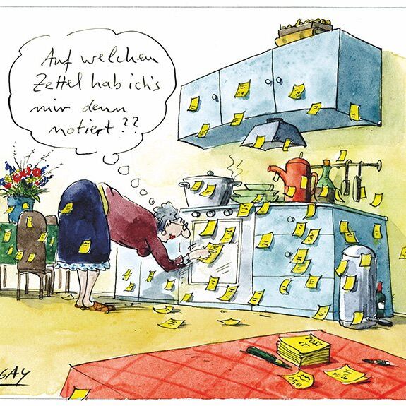 Oma sucht in der Küche den richtigen Zettel. Es gibt sehr viele Zettel.