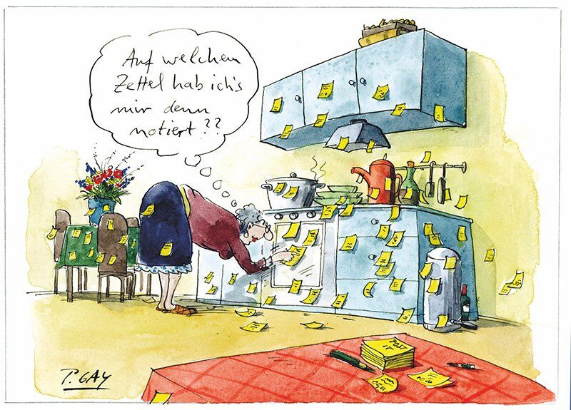 Oma sucht in der Küche den richtigen Zettel. Es gibt sehr viele Zettel.